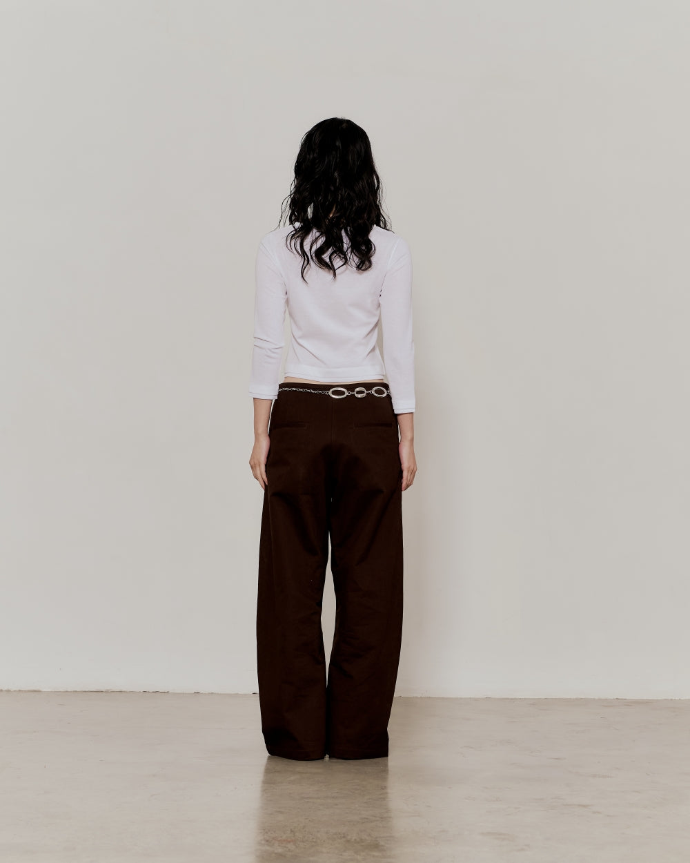 BAGGY CURVED PANTS IN BROWN